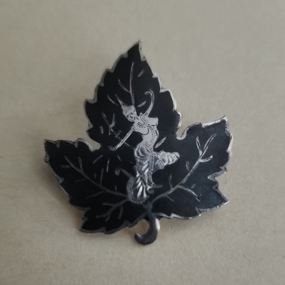 Black Leaf Brooch with Silver Design